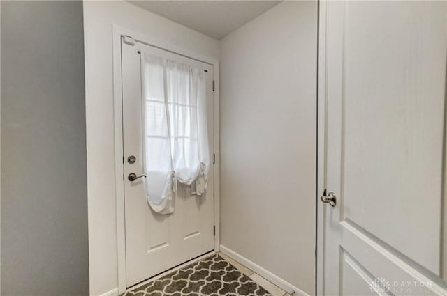 doorway featuring tile patterned floors