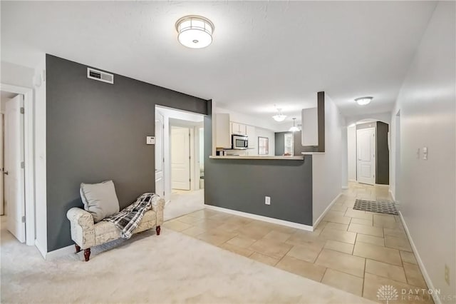 interior space with light tile patterned flooring