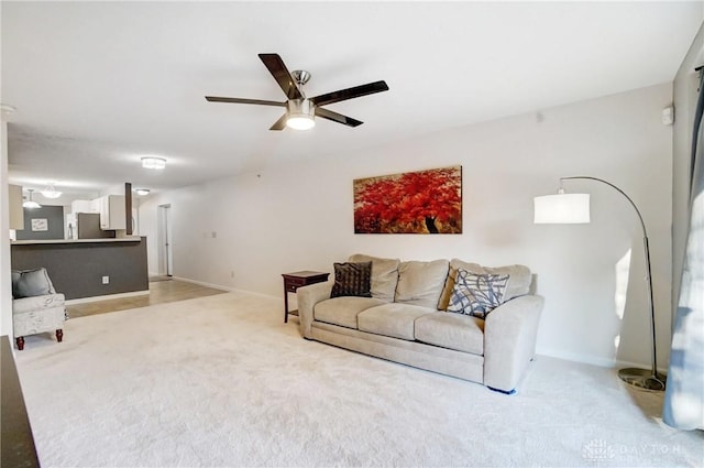 living room featuring carpet floors and ceiling fan