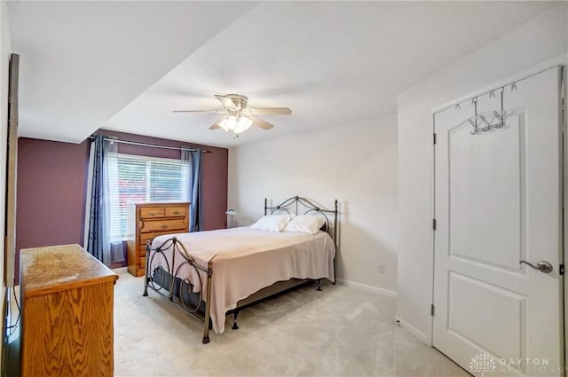 bedroom featuring ceiling fan and light colored carpet