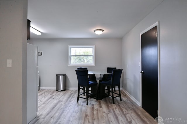 dining area featuring light wood-type flooring