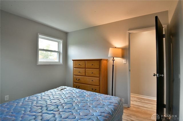 bedroom with light wood-type flooring