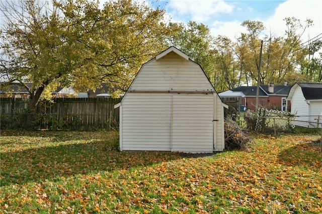 view of outbuilding featuring a yard