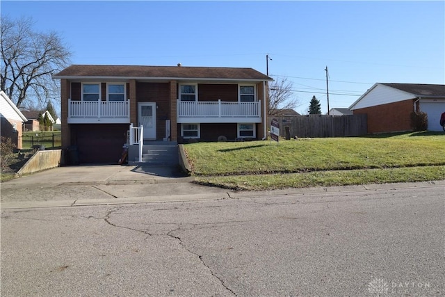 split foyer home with a front lawn