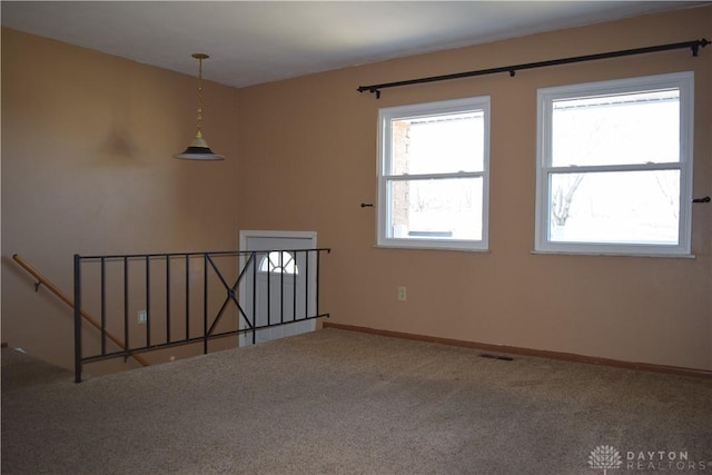 empty room featuring carpet floors