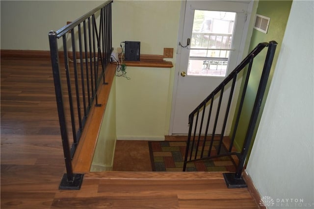 stairway with wood-type flooring