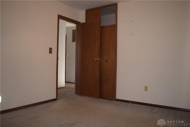 unfurnished room with light colored carpet