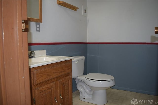 bathroom featuring vanity and toilet