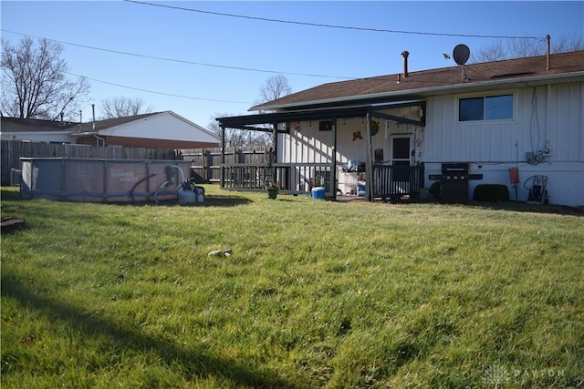 view of yard with a fenced in pool