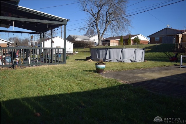 view of yard with a fenced in pool