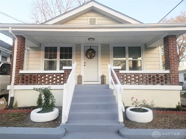 view of front of property featuring covered porch