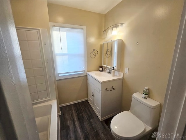 bathroom featuring vanity, hardwood / wood-style floors, a shower with curtain, and toilet