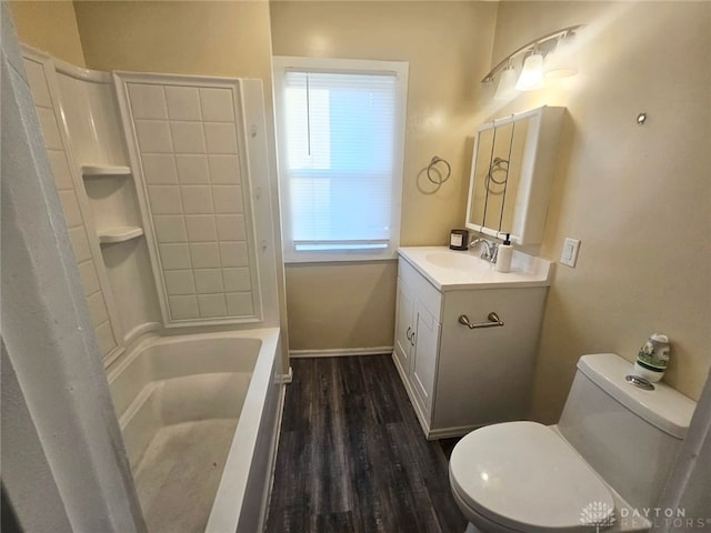 full bathroom featuring vanity, wood-type flooring, toilet, and bathing tub / shower combination