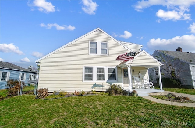 view of front facade with covered porch and a front yard