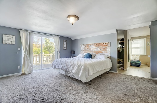 carpeted bedroom with access to outside