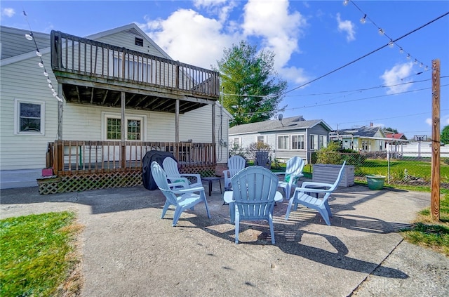 view of patio / terrace with a deck and a fire pit