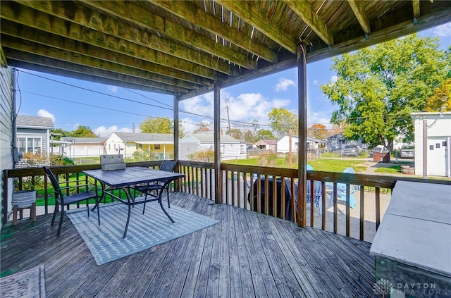 wooden terrace with a shed