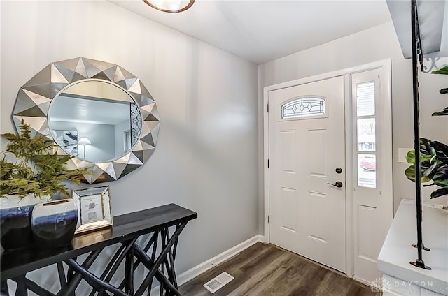 entryway with dark wood-type flooring