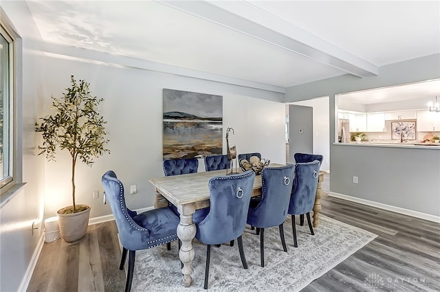 dining space featuring beam ceiling and hardwood / wood-style flooring