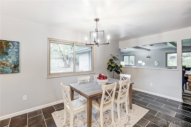 dining area featuring a notable chandelier and plenty of natural light