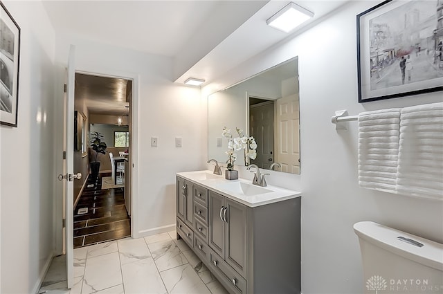 bathroom featuring toilet and vanity