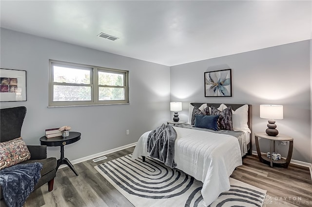 bedroom with wood-type flooring