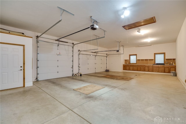 garage featuring a garage door opener