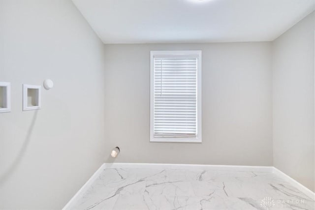 laundry area with marble finish floor, laundry area, washer hookup, and baseboards