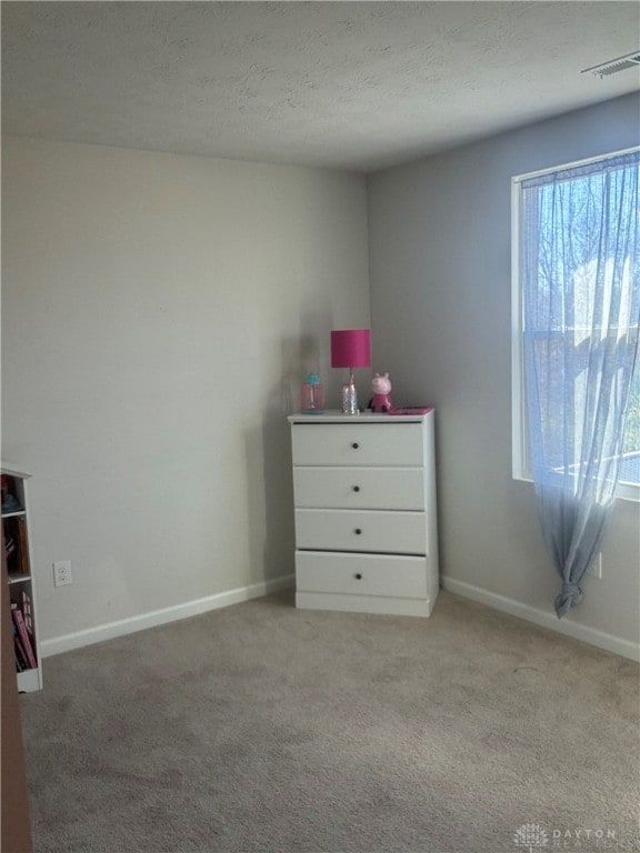 unfurnished bedroom with carpet