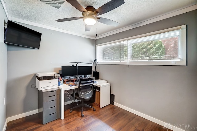 office with ceiling fan, a textured ceiling, ornamental molding, and dark hardwood / wood-style floors