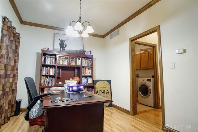 home office featuring washer / clothes dryer, a chandelier, ornamental molding, and light hardwood / wood-style flooring