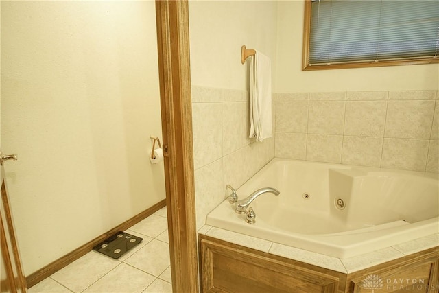 bathroom with tile patterned floors and a bathing tub