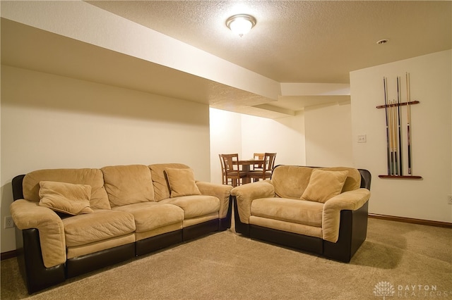 carpeted living room featuring a textured ceiling