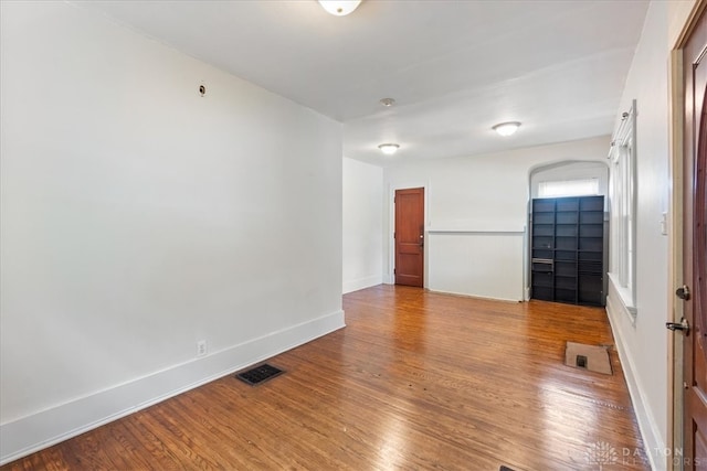 spare room featuring hardwood / wood-style flooring