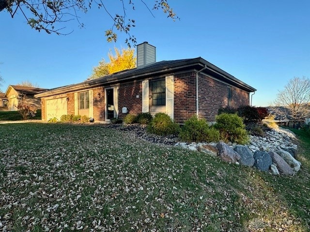 exterior space with a front lawn and a garage