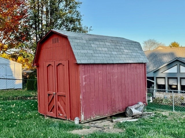 view of outbuilding with a yard