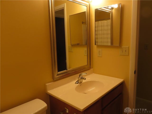 bathroom with vanity and toilet