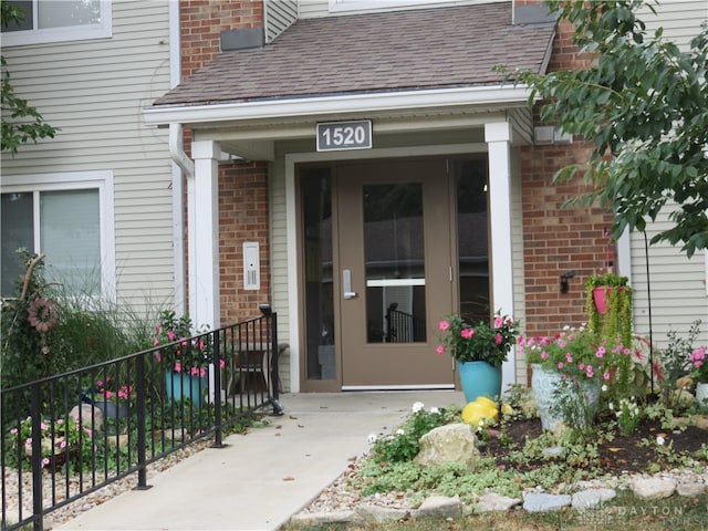 doorway to property featuring covered porch