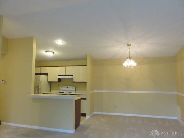 kitchen featuring light carpet, kitchen peninsula, white appliances, decorative light fixtures, and white cabinetry