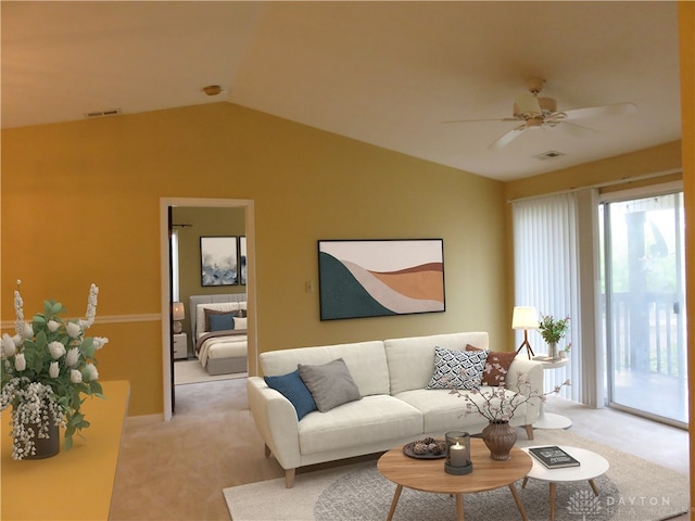 carpeted living room with ceiling fan and lofted ceiling