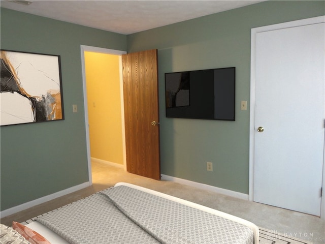 carpeted bedroom with baseboards