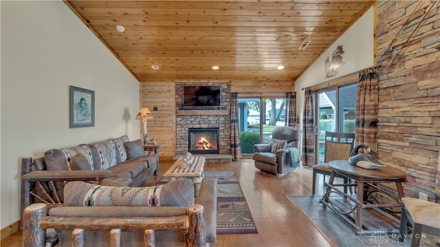 living room with a stone fireplace, wood ceiling, high vaulted ceiling, and wood-type flooring