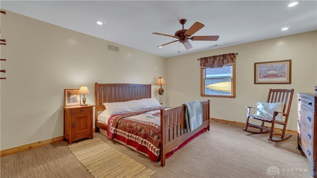 bedroom with light colored carpet and ceiling fan