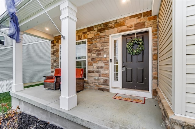 doorway to property with covered porch