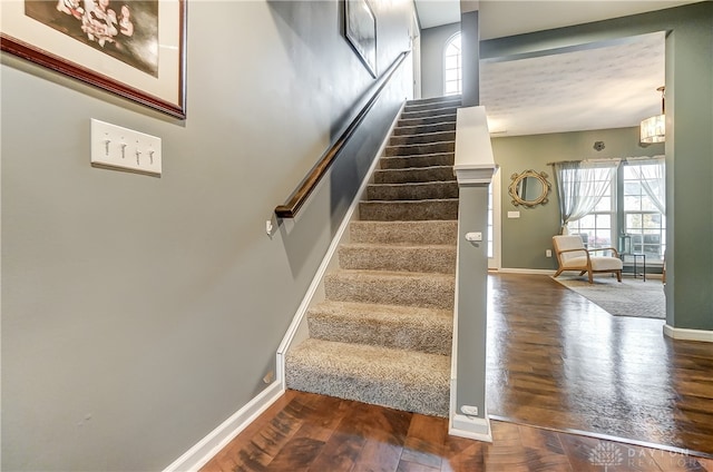 stairs with hardwood / wood-style floors