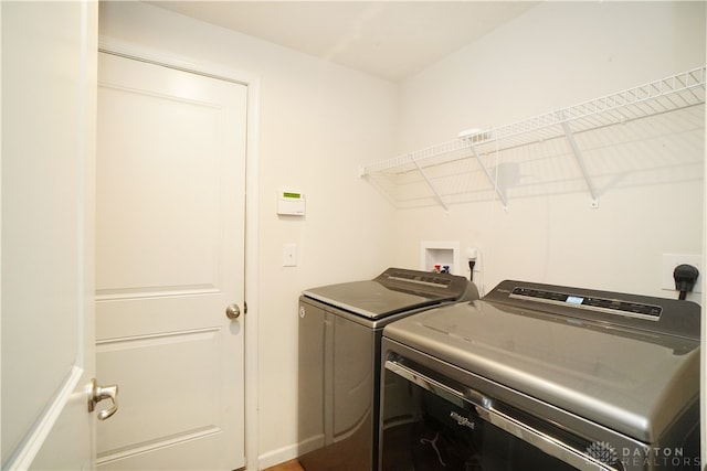 washroom with washer and dryer