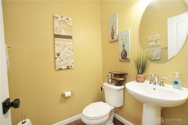 bathroom with sink and toilet