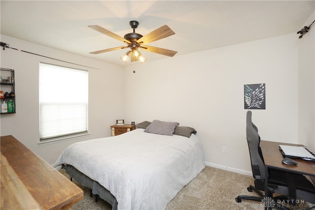 bedroom with ceiling fan and light colored carpet