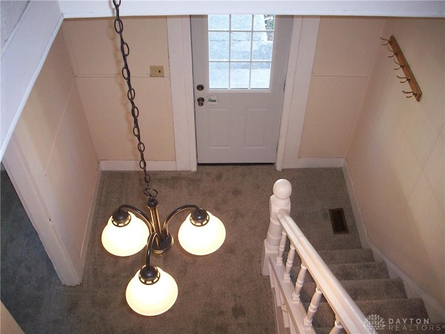 entrance foyer featuring stairs and visible vents