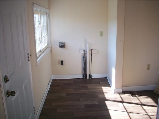 clothes washing area with baseboards, laundry area, dark wood-style flooring, and hookup for an electric dryer